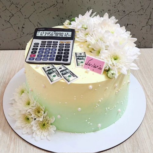 کیک روز حسابدار با تزیین ماشین حساب  و دلار
